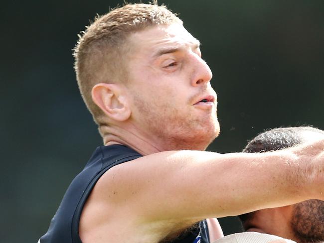 Collingwood vs Carlton at Morwell Recreational Reserve. 11/03/2019 .   Carlton's Liam Jones spoils from behind Collingwood's Travis Varcoe    . Pic: Michael Klein