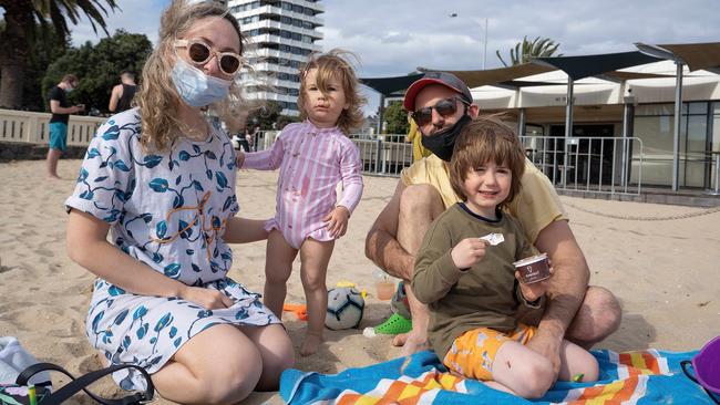 Slav and Olga Letiolat with their children Nikita, 1, and Leo, 4, on Middle Park beach. Picture: Stefan Postles