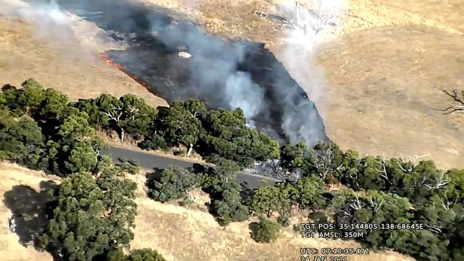 Aerial images show a fire burning away from a road near Cherry Gardens, supporting beliefs the fire was deliberately lit. Pic: supplied