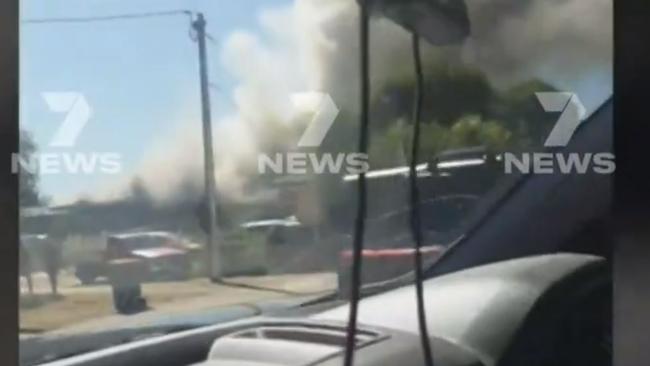 A 16-year-old boy has risked his own life to rescue neighbours he thought were trapped inside a burning house at Salisbury East. A pet dog and firefighter were treated at the scene. Picture: 7NEWS