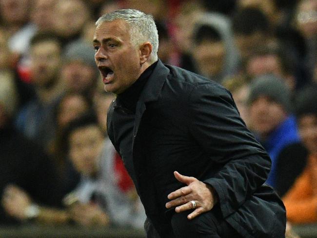 Manchester United's Portuguese manager Jose Mourinho gestures during the English Premier League football match between Manchester United and Newcastle at Old Trafford in Manchester, north west England, on October 6, 2018. (Photo by Oli SCARFF / AFP) / RESTRICTED TO EDITORIAL USE. No use with unauthorized audio, video, data, fixture lists, club/league logos or 'live' services. Online in-match use limited to 120 images. An additional 40 images may be used in extra time. No video emulation. Social media in-match use limited to 120 images. An additional 40 images may be used in extra time. No use in betting publications, games or single club/league/player publications. /