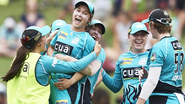 Brisbane Heat players celebrate their WBBL semi-final win.