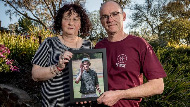 Matt and Robyn Cronin with a picture of their son, Pat. Picture: Jake Nowakowski