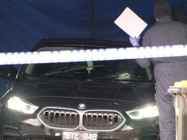 A bullet hole in the windshield of the BMW in which Mr Fatho was found dead. Picture: Luis Enrique Ascui