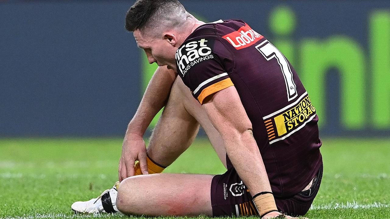 Tyson Gamble sits dejected after the Broncos were smashed by the Rabbitohs on Thursday night. Picture: Getty Images