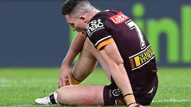 Tyson Gamble sits dejected after the Broncos were smashed by the Rabbitohs on Thursday night. Picture: Getty Images