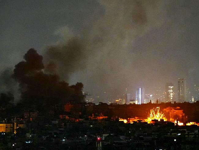 Smoke rises and a fireball erupts from the site of Israeli air strikes that targeted Beirut’s southern suburbs. Picture: AFP