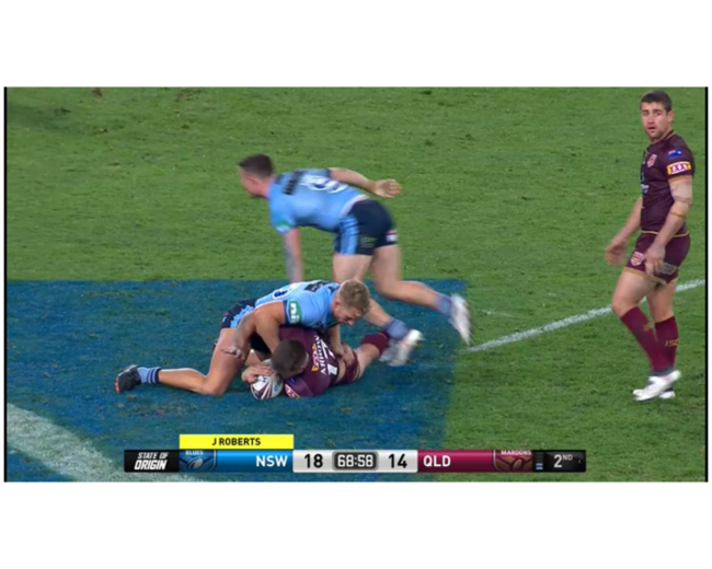 Maroons hooker Andrew McCullough looks to his left ...