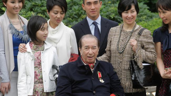 Hong Kong tycoon Stanley Ho (C) poses for a photo at Government House in Hong Kong in 2010 after receiving the Grand Bauhinia Medal. Picture: AFP.