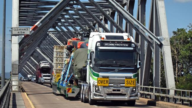 MHR-90 Taipan helicopter crosses the Burdekin Bridge on the back of a truck. Picture: Bryan Lynch