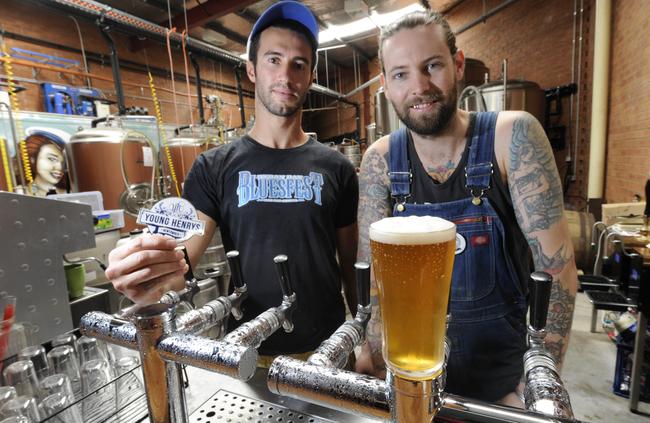 Assistant brewers Ben Joseph and Oscar McMahon in 2012 with the Newtowner, the beer the brewery created in honour of the suburb’s 150th anniversary. Picture: Craig Wilson