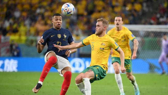 France's forward #10 Kylian Mbappe (L) fights for the ball with Australia's midfielder #03 Nathaniel Atkinson during the Qatar 2022 World Cup Group D football match between France and Australia at the Al-Janoub Stadium in Al-Wakrah, south of Doha on November 22, 2022. (Photo by FRANCK FIFE / AFP)