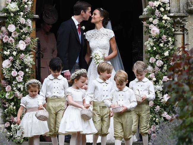 Pippa Middleton kisses her new husband James Matthews, following their wedding ceremony at St Mark's Church. Picture: Justin Tallis