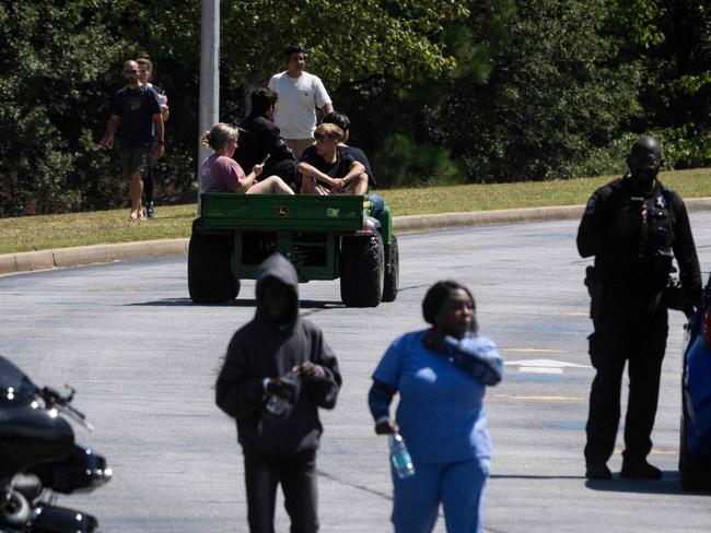 Students are evacuated from the scene. Picture: AFP