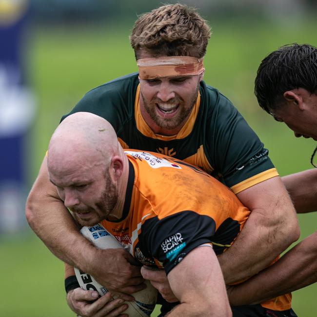 Adam McInnes held in a tackle. Picture: Julian Andrews
