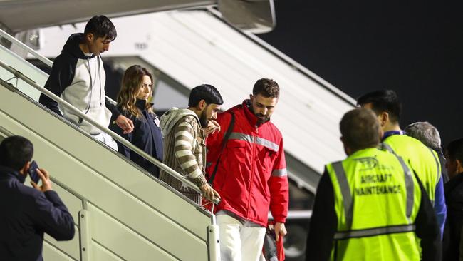 Airport ground staff and medics assist survivors of the Azerbaijan crash. Picture: Getty Images