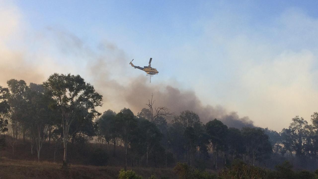 A raging bushfire at Woolooga continued to worsen and threatened the township as terrified residents prepared to leave.