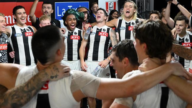 BRISBANE, AUSTRALIA - MARCH 28: Players of the Magpies sign the team song after the round 3 AFL match between the Brisbane Lions and Collingwood Magpies at The Gabba, on March 28, 2024, in Brisbane, Australia. (Photo by Matt Roberts/AFL Photos/Getty Images)