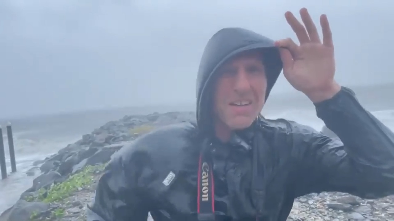 Reporter on the edge of a Category 2 Cyclone