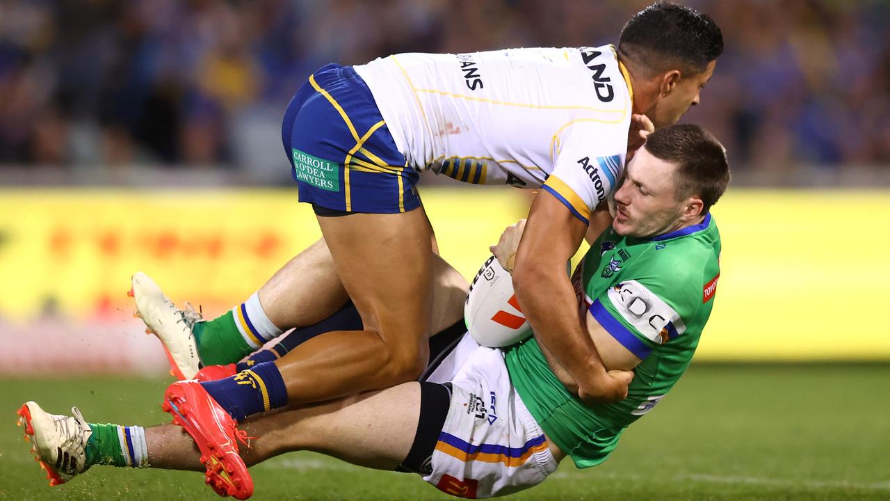 Dylan Brown tackles James Schiller of the Raiders. Photo by Mark Nolan/Getty Images.