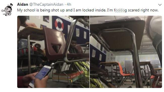 ‘I'm f.....g scared right now’ ... Twitter post showing students cowering beneath their desks as the gunman shot up their school. Picture: @TheCaptainAidan/Twitter