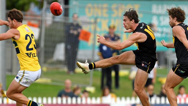 Glenelg's Luke Partington gets a kick away. Picture: Tom Huntley