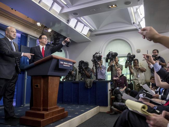 National Economic Director Gary Cohn, left, and Treasury Secretary Steve Mnuchin had few answers in terms of how the tax breaks would be paid for.  Picture:  AP