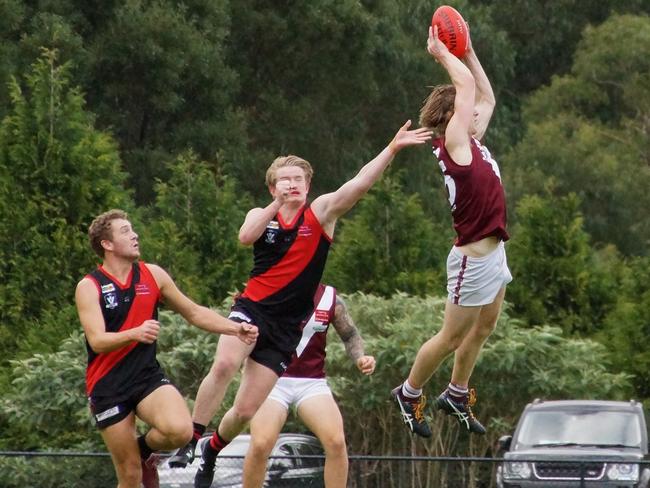 Mt Evelyn’s Callum Urquhart takes a strong mark against Emerald. Picture: Robyn Kuys