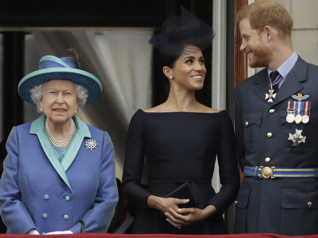 The Queen on the balcony at Buckingham Palace with Meghan and Harry when the couple were still senior royals. Picture: AP Photo/Matt Dunham