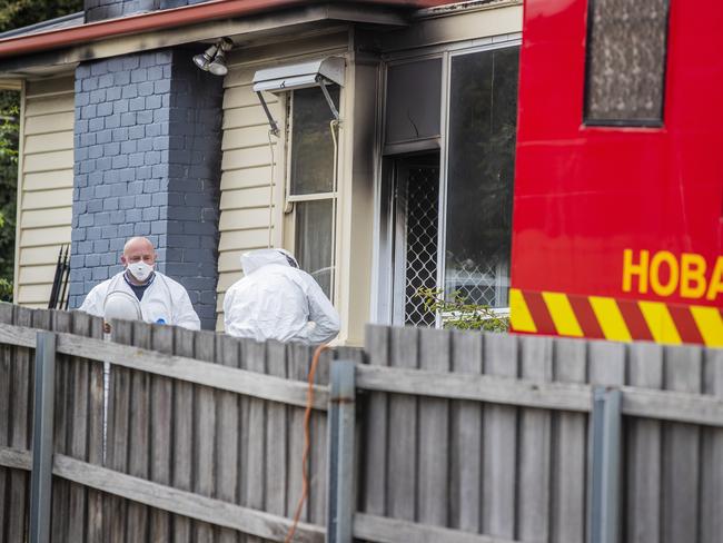 Investigators and Police attend the site of an overnight house fire on Brooker Highway, Lutana. Picture: Richard Jupe