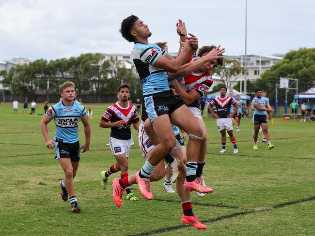 Michael Nassar &amp; Elijah Paea contest another kick. Picture: Adam Wrightson Photography