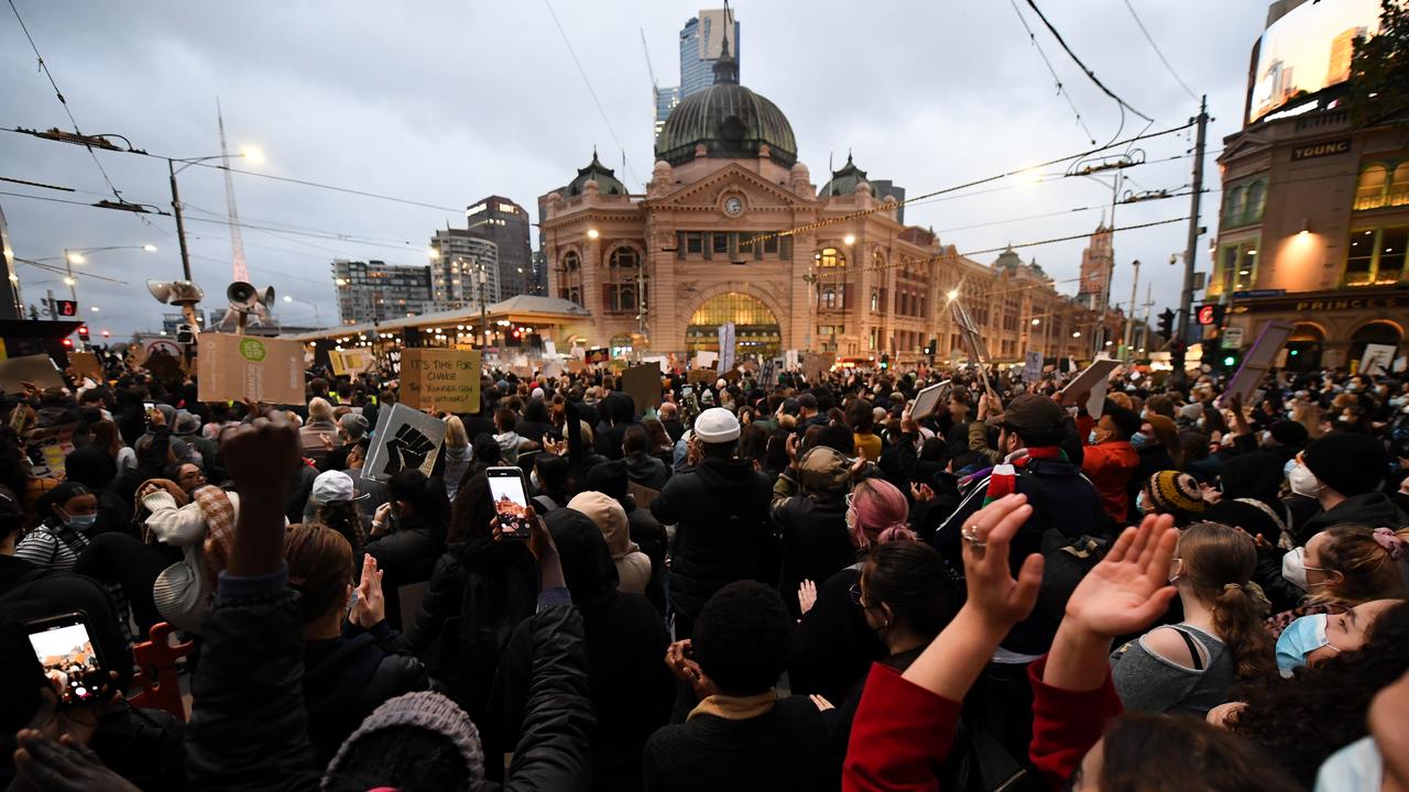 Protesters rallied outside Flinders Street railway station in Melbourne. Picture: AAP/James Ross