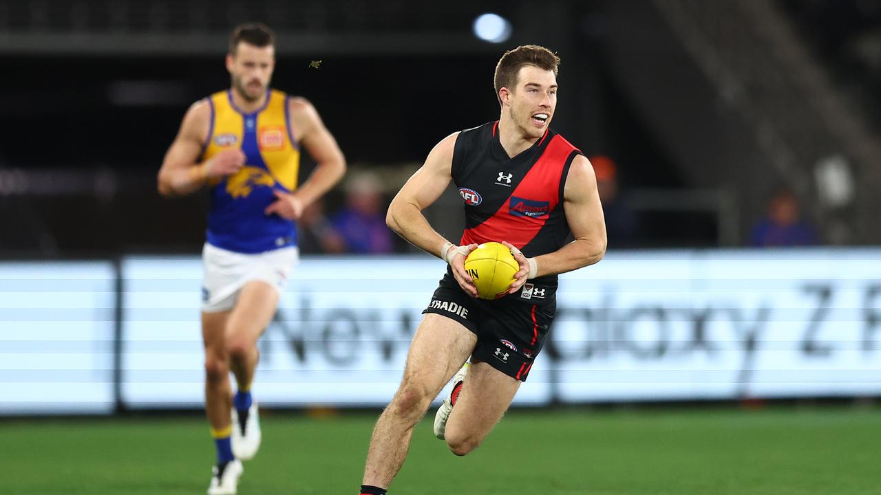 MELBOURNE, AUSTRALIA – AUGUST 05: Zach Merrett of the Bombers in action during the round 21 AFL match between Essendon Bombers and West Coast Eagles at Marvel Stadium on August 05, 2023 in Melbourne, Australia. (Photo by Graham Denholm/AFL Photos via Getty Images)