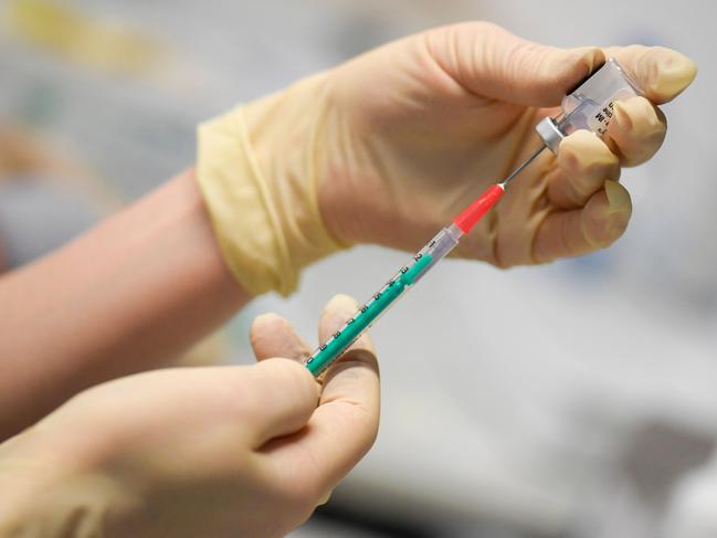 A syringe is filled with the BioNTech/Pfizer vaccine against COVID-19 at the vaccination center of machine tools and laser technology company Trumpf in Ditzingen, southern Germany, on June 10, 2021, amid the novel coronavirus / COVID-19 pandemic. (Photo by THOMAS KIENZLE / AFP)