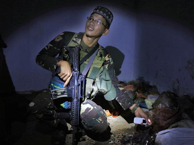 Soldiers from the 1st Field Artillery Battalion at a fire support base, outside of Marawi. Picture: Gary Ramage