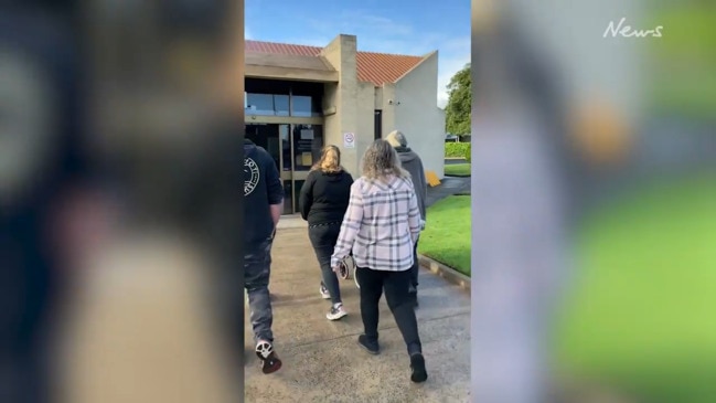 Bradley Tye Long's family shield his face from the media