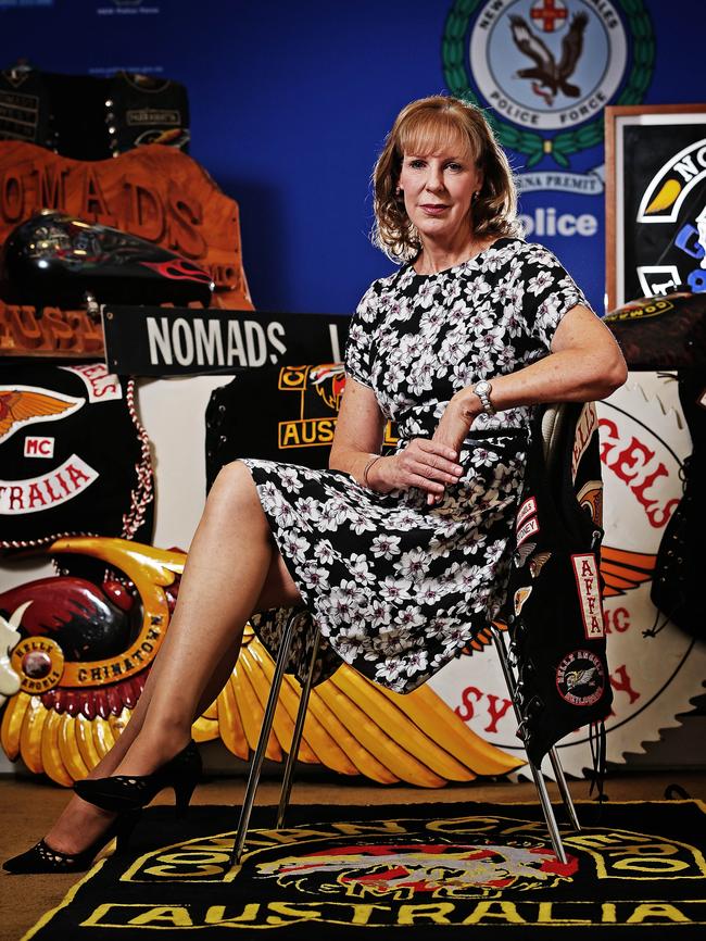 Deb Wallace, commander of the NSW Gangs Squad, pictured with seized gang regalia Photo: Sam Ruttyn