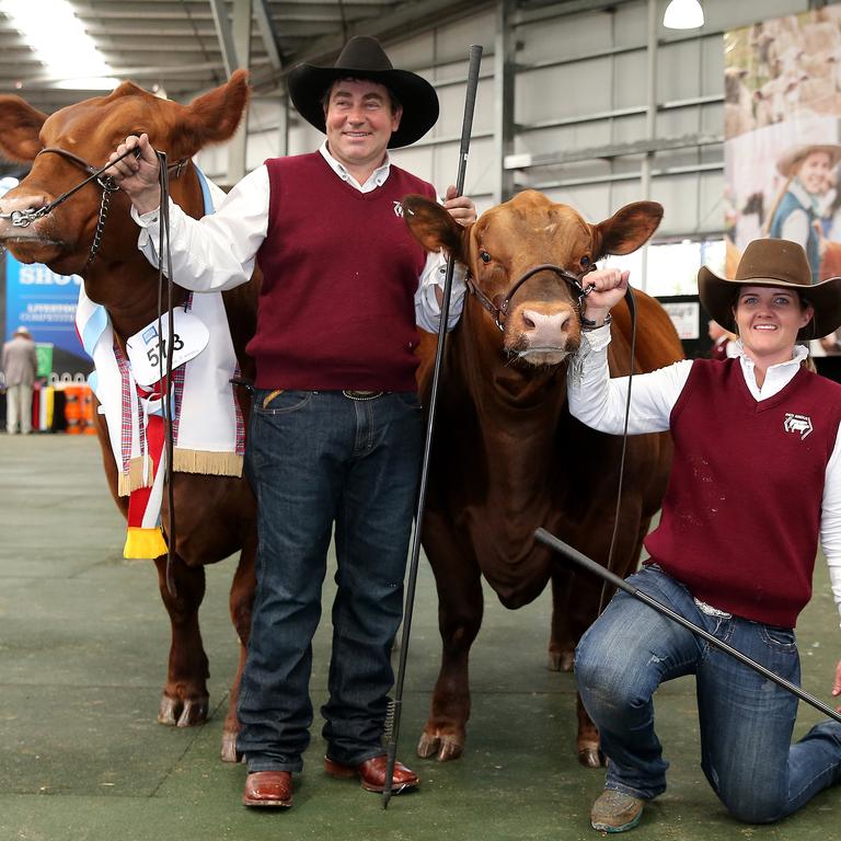 Gavin Iseppi, from Dalby, QLD, and Christie Kennedy with the Supreme Champion red angus cow at the Royal Melbourne Show. Picture: Yuri Kouzmin