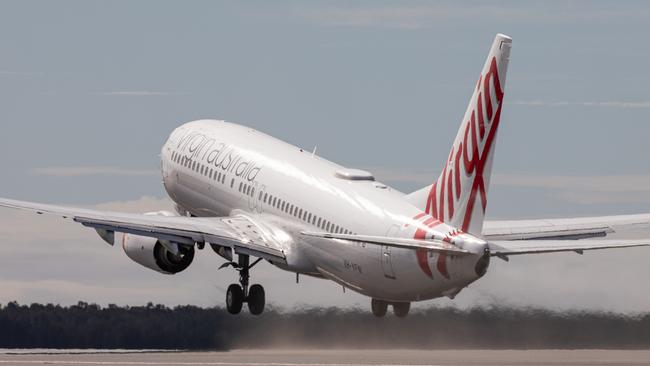 A plane takes off from the second runway when it opened in July, 2020. Air traffic has grown since then, as well as noise. Picture: Beau Chenery