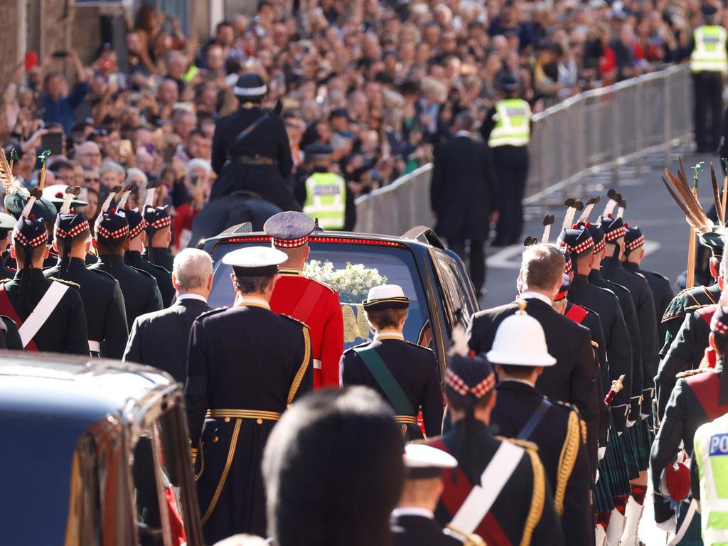 Prince Andrew, Duke of York, Princess Anne, Princess Royal and Britain's King Charles III (obscured) AFP