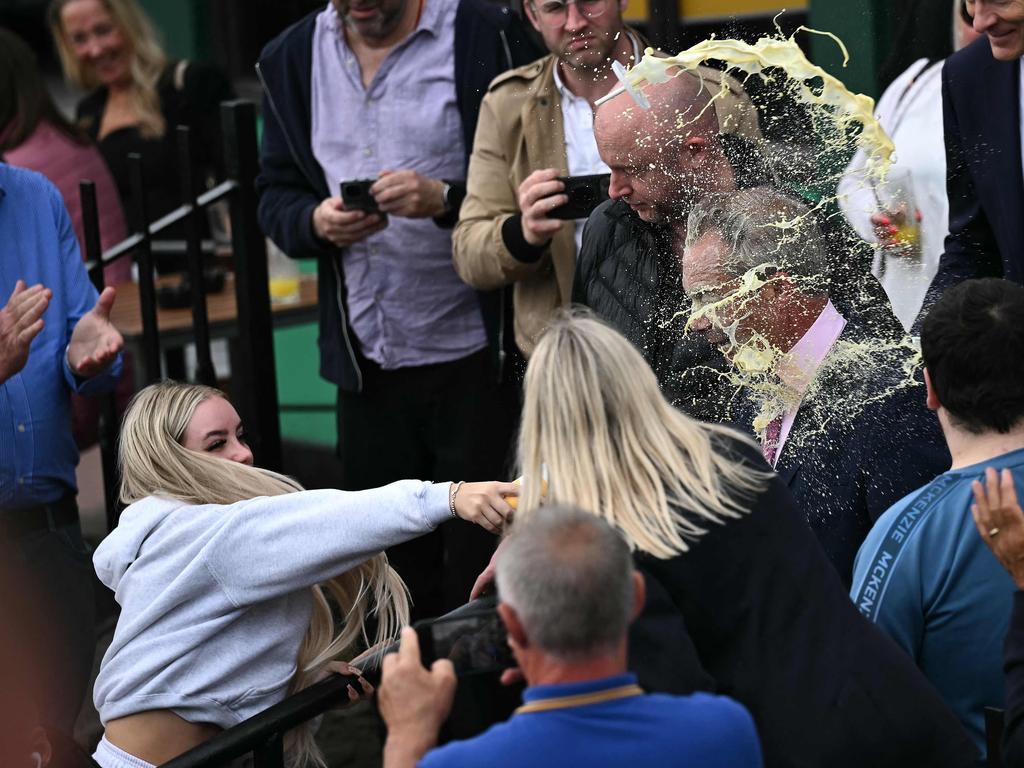 Farage gets a face full of banana thickshake. Picture: Ben Stansall / AFP