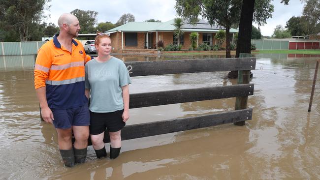 Alain and Jess Gobbo watch floodwaters in their front yard at Huntly near Bendigo. Picture: David Crosling