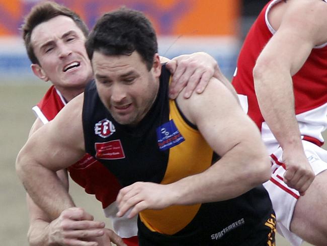 EDFL Football: Westmeadows V Glenroy at Willowbrook Reserve West Meadows. Andrew McLean of Westmeadows and Daniel Marks and Brenton Faulkner of Glenroy. Picture: Richard Serong