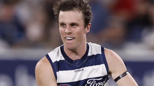 GEELONG, AUSTRALIA - MARCH 16:  Max Holmes of the Cats runs with the ball during the round one AFL match between Geelong Cats and St Kilda Saints at GMHBA Stadium, on March 16, 2024, in Geelong, Australia. (Photo by Darrian Traynor/Getty Images)