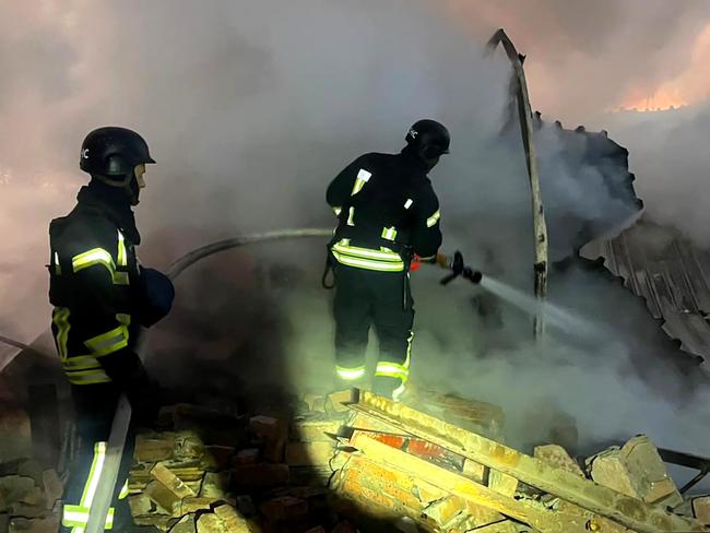 In this handout photograph taken and released by the Ukrainian Emergency Service on November 28, 2024, Ukrainian rescuers work to extinguish a fire at an energy infrastructure facility following a missile attack in Lutsk, Volyn region, amid the Russian invasion of Ukraine. More than a million Ukrainians were left without power in freezing cold temperatures on November 28, 2024 after a massive nationwide Russian missile and drone attack. (Photo by Handout / UKRAINIAN EMERGENCY SERVICE / AFP) / RESTRICTED TO EDITORIAL USE - MANDATORY CREDIT "AFP PHOTO / UKRAINIAN EMERGENCY SERVICE" - NO MARKETING NO ADVERTISING CAMPAIGNS - DISTRIBUTED AS A SERVICE TO CLIENTS