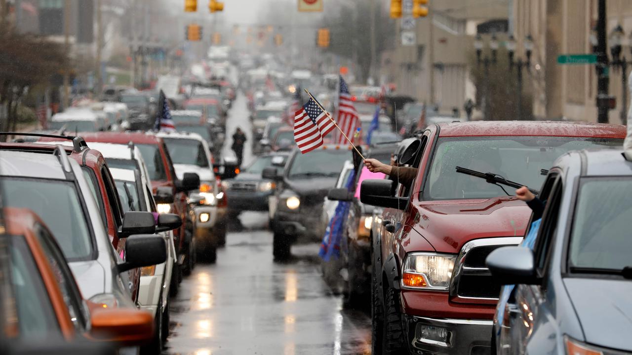 Michigan residents took to the streets in their cars to protest excessive lockdowns by their Governor. Picture: Jeff Kowalsky/AFP