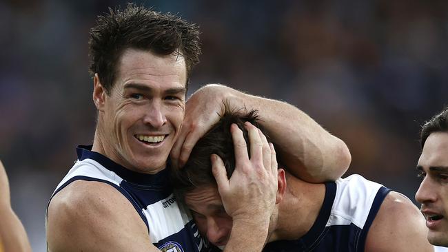 MELBOURNE . 10/04/2023.  AFL . Round 4. Geelong vs Hawthorn at the MCG.  Jeremy Cameron hugs Tom Hawkins after Hawkins gave a handball to Tyson Stengle for an easy goal  . Pic: Michael Klein