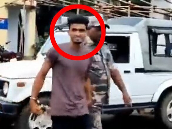 Shahrukh Hussain was seen smirking in a video as he was arrested. Picture: Twitter