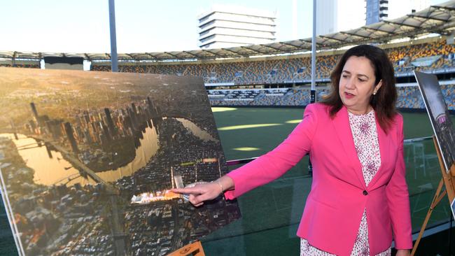 Then-premier Annastacia Palaszczuk looks at artist impressions of a Gabba rebuild plan for the 2032 Olympic and Paralympic Games. Picture: Dan Peled