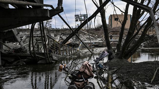 Abandoned strollers under a destroyed bridge as people flee the city of Irpin, west of Kyiv.